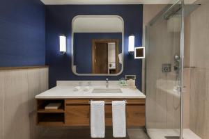 a bathroom with a sink and a mirror at Elite World Asia Hotel in Istanbul