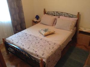 Postel nebo postele na pokoji v ubytování Apartments Bosiljka