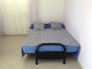 Postel nebo postele na pokoji v ubytování Apartments Bosiljka