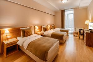 Postel nebo postele na pokoji v ubytování Porta Caucasia Kazbegi