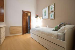 A bed or beds in a room at Abades Cathedral Oasis