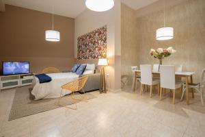 A bed or beds in a room at Abades Cathedral Oasis