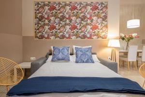 A bed or beds in a room at Abades Cathedral Oasis