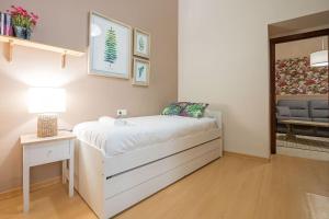A bed or beds in a room at Abades Cathedral Oasis