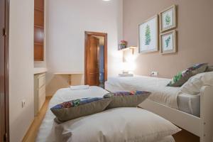 A bed or beds in a room at Abades Cathedral Oasis