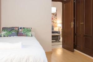 A bed or beds in a room at Abades Cathedral Oasis