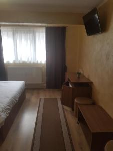 TV a/nebo společenská místnost v ubytování EFM Motel + 19 fotografií