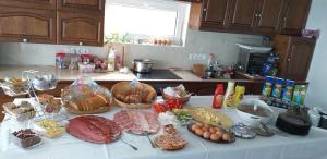a table with many different types of food on it at Gránit Villa - freshly renovated in Balatonszárszó +94 photos