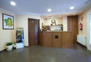 a lobby with a reception desk in a building at HOTEL PARRILLADA TERRANOVA in Oza dos Ríos