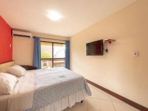 Μια τηλεόραση ή/και κέντρο ψυχαγωγίας στο Happy Hotel Praia Azul