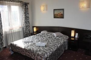 Posteľ alebo postele v izbe v ubytovaní Hotel Monet & Rubbens