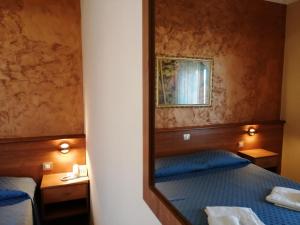 Postel nebo postele na pokoji v ubytování Hotel Il Vulcano