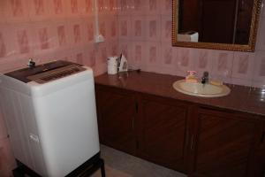 Ett badrum på Résidence An&Sy - Loft à Surinam