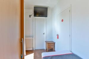 TV a/nebo společenská místnost v ubytování Hostal Alberana