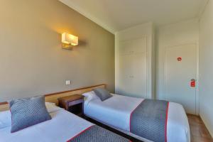 Postel nebo postele na pokoji v ubytování Hostal Alberana