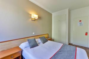 Postel nebo postele na pokoji v ubytování Hostal Alberana