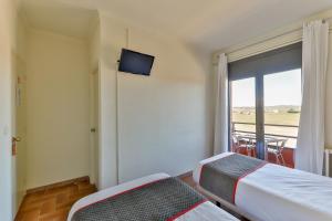 Postel nebo postele na pokoji v ubytování Hostal Alberana