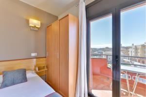 Postel nebo postele na pokoji v ubytování Hostal Alberana