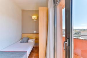 Postel nebo postele na pokoji v ubytování Hostal Alberana
