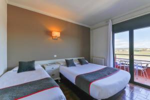 Postel nebo postele na pokoji v ubytování Hostal Alberana