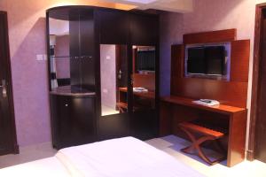 TV a/nebo společenská místnost v ubytování Horizon Hotel Apartments - الأفق للشقق الفندقية