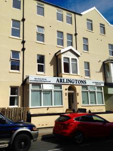 a building with a car parked in front of it at Arlingtons in Blackpool