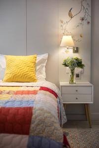 Postel nebo postele na pokoji v ubytování Maison De Camille Boutique Hotel