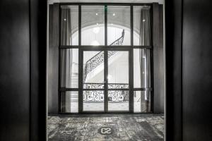 an open door with a view of a staircase at Hotel C2 in Marseille