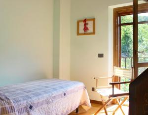 A bed or beds in a room at Villa Erica con piscina privata sul lago di Como