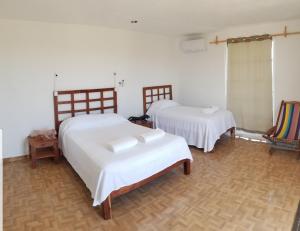 Ένα ή περισσότερα κρεβάτια σε δωμάτιο στο Casa ka'an +105 φωτογραφίες