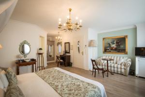 Postel nebo postele na pokoji v ubytování Hotel Belle Epoque