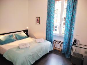 Ένα ή περισσότερα κρεβάτια σε δωμάτιο στο Casa Italiano - BestBnB Garbatella
