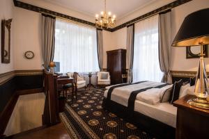 Postel nebo postele na pokoji v ubytování Hotel Belle Epoque