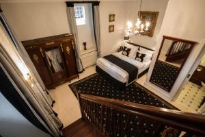 Postel nebo postele na pokoji v ubytování Hotel Belle Epoque