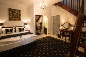 Postel nebo postele na pokoji v ubytování Hotel Belle Epoque