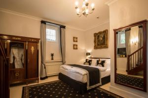 Postel nebo postele na pokoji v ubytování Hotel Belle Epoque