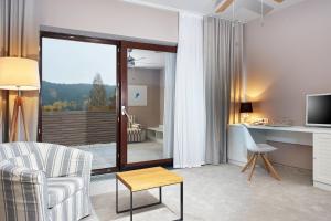 TV a/nebo společenská místnost v ubytování Cihelny Golf & Wellness Resort