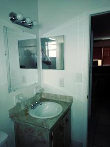 a bathroom with a sink and a mirror at Newly Furnished Large Clean Quiet Private Unit in Fort Lauderdale