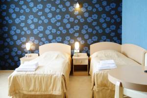 Posteľ alebo postele v izbe v ubytovaní Hotel Fajkier