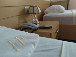 Кровать или кровати в номере Hotel Family