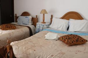 Tempat tidur dalam kamar di Casa Romão