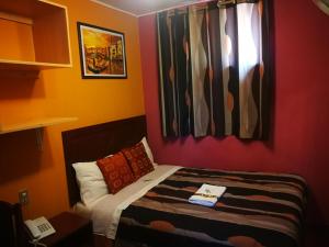 Postel nebo postele na pokoji v ubytování Hostal GQ