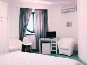 Krevet ili kreveti u jedinici u okviru objekta Hotel Falco D'oro