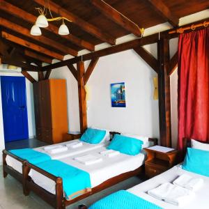Postel nebo postele na pokoji v ubytování Hotel Mochlos