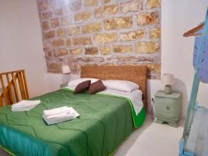 Posteľ alebo postele v izbe v ubytovaní Baglio Reale Apartments