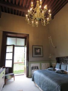 a bedroom with a bed and a lamp at 1850 Hotel Boutique in Guanajuato
