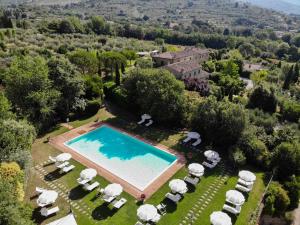 an aerial view of a villa with a swimming pool at Villa Borgo San Pietro in Cortona