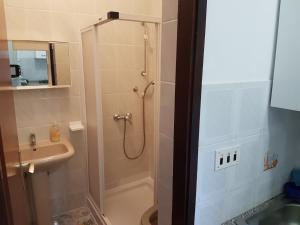 a bathroom with a shower and a sink at Apartments Zova in Medulin