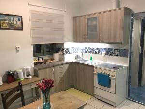 Kuchyňa alebo kuchynka v ubytovaní Odyssey Apartment