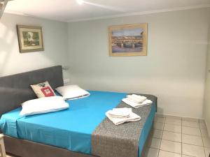 Posteľ alebo postele v izbe v ubytovaní Odyssey Apartment